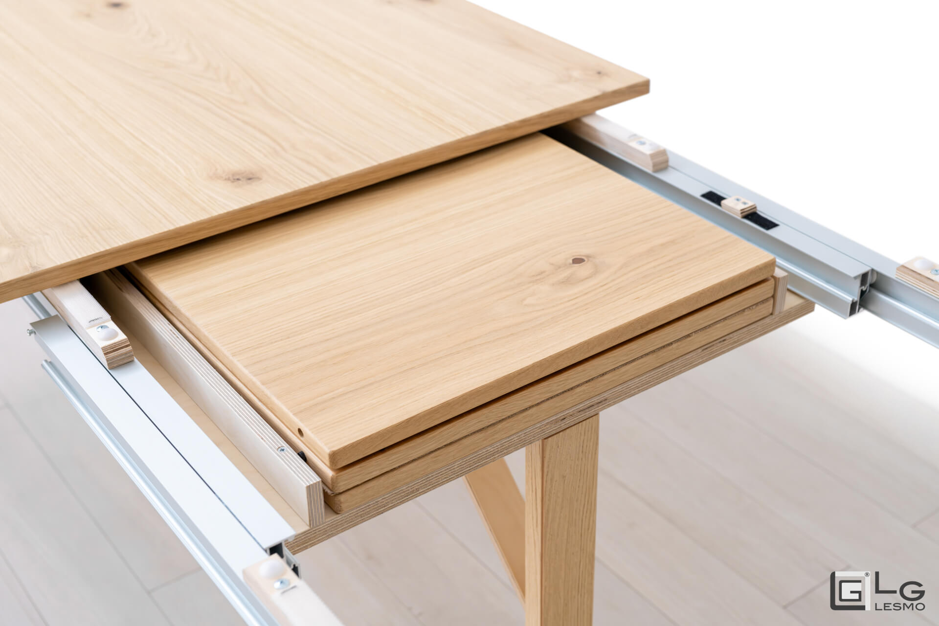 EXTENDABLE TABLE<br>Finish: Raw Oak<br>up to 12 seats